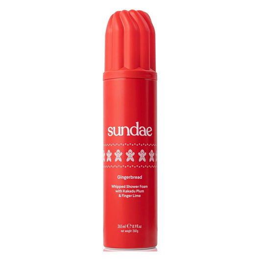 Red bottle of Sundae Gingerbread Whipped Shower Foam on a white background