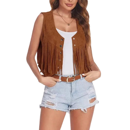 Woman wearing a brown fringe vest over a white top and light blue denim shorts on a white background