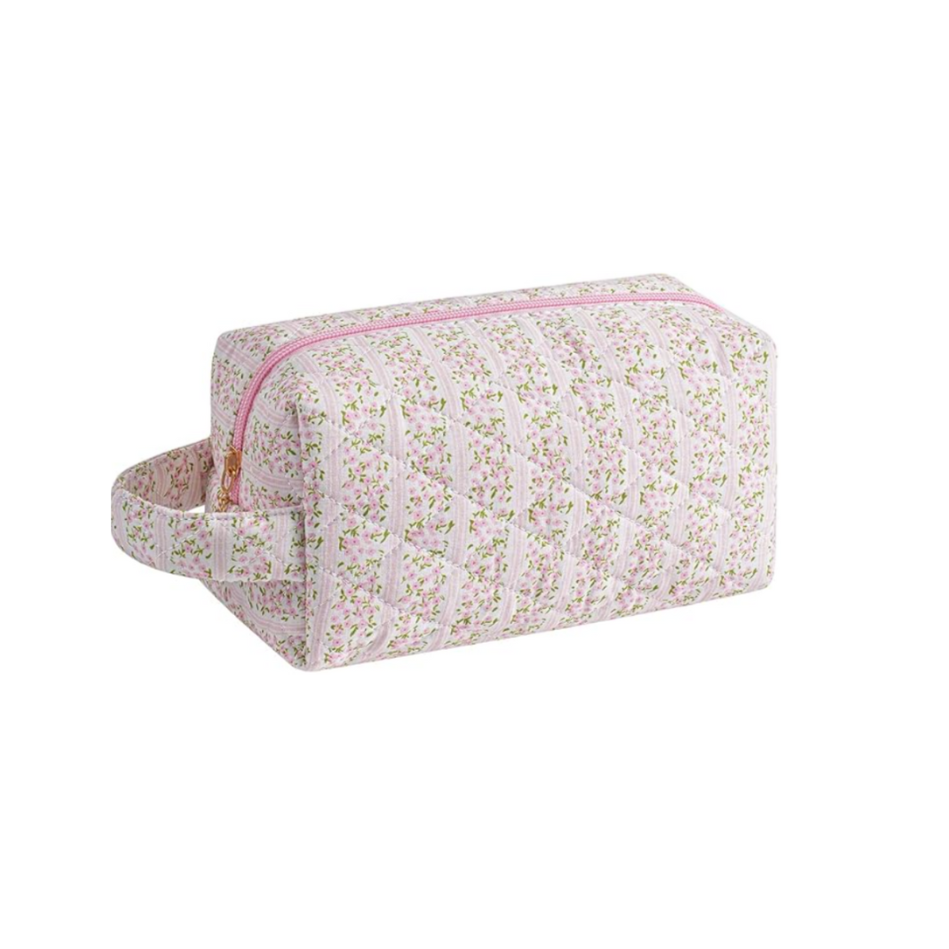 Floral-patterned makeup bag with a pink zipper on a white background