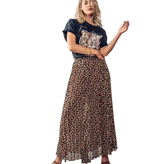 Woman wearing a leopard print skirt and a t-shirt with a tiger design on a gray background