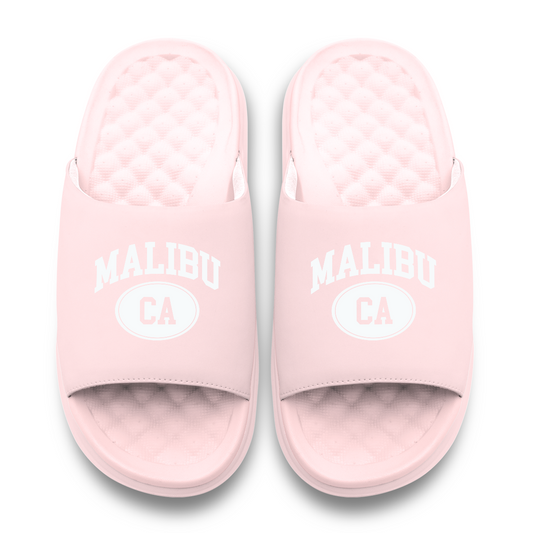 Pair of pink slides with 'Malibu CA' text on a white background