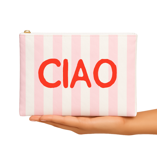 Pink and white striped pouch with 'CIAO' text held in a hand on a white background