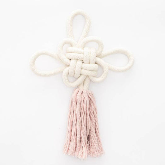 Decorative knot with a pink tassel on a white background
